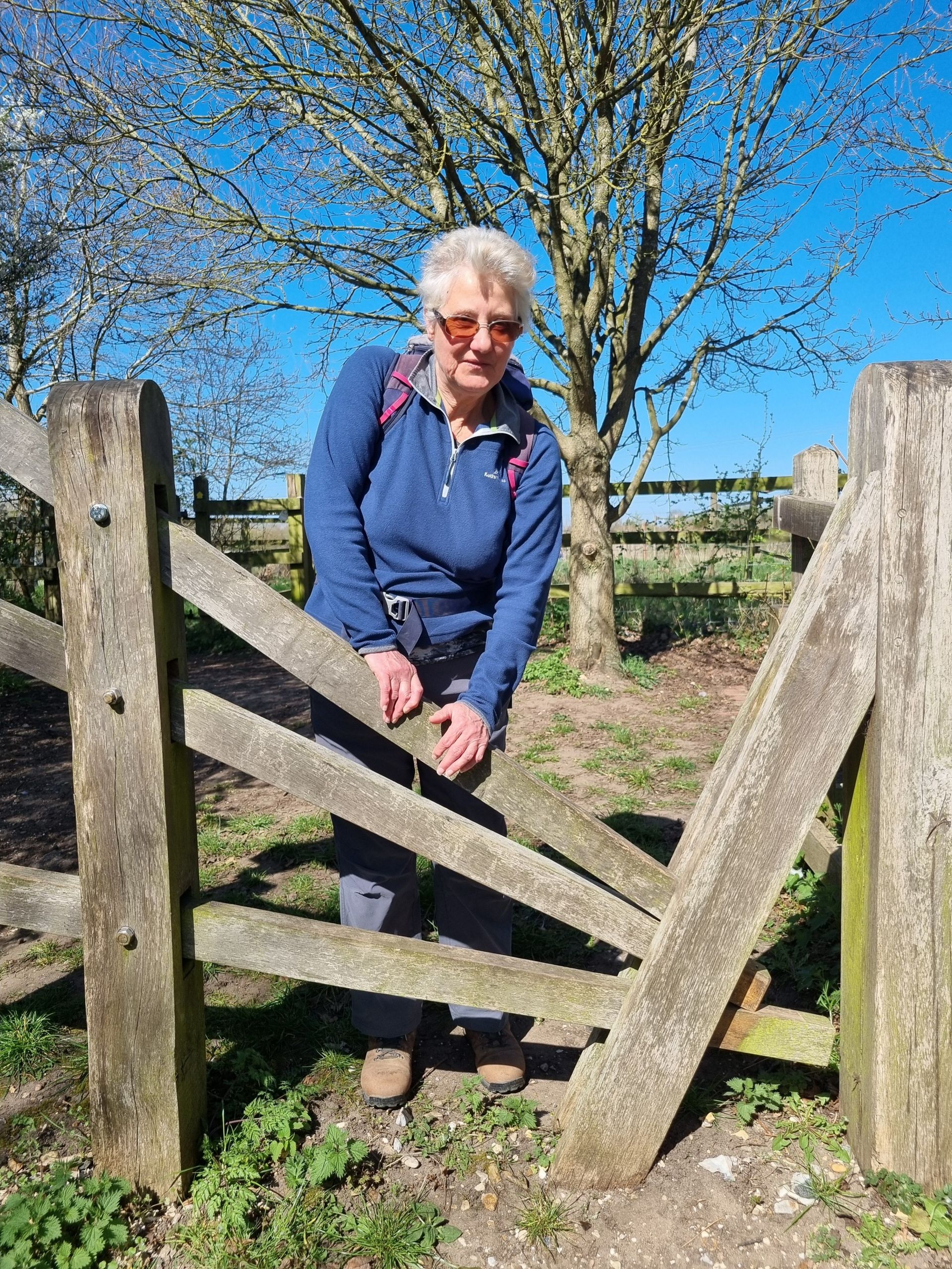 Person crossing via the clapper gate stile